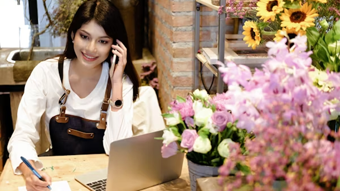 Small business owner using laptop to manage online presence